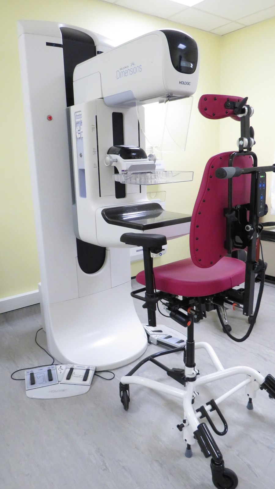 REAL 8200 Mammography Chair in a clinic, beside the mammography unit